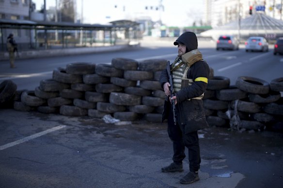 Civilians stand in defense of Kyiv, Ukraine, Saturday, Feb. 26, 2022.