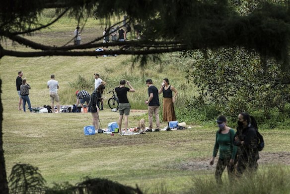 Picnics are packed up as the rain begins to fall at Centennial Park, as some restrictions ease.