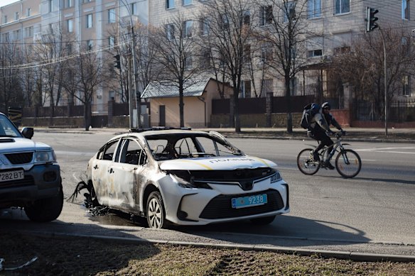 A burned car in the Solomianska area of Kyiv. Explosions and gunfire were reported around Kyiv throughout Saturday.