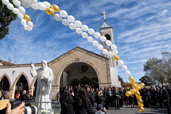 Mourners outside StCharbel's Church during Lametta Fadlallah's funeral.