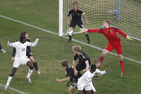 Germany goalkeeper Manuel Neuer reaches for the ball.