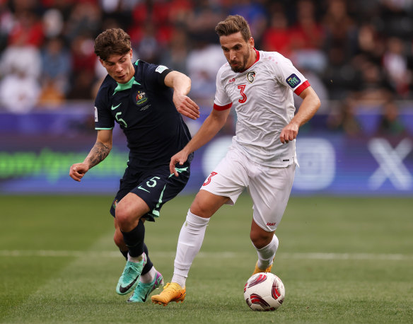 Moayad Ajan of Syria battles for possession with Jordan Bos.