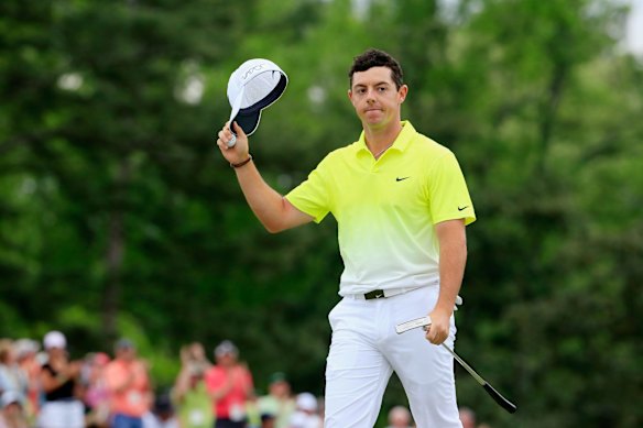 Rory McIlroy of Northern Ireland waves to the gallery on the 18th green.