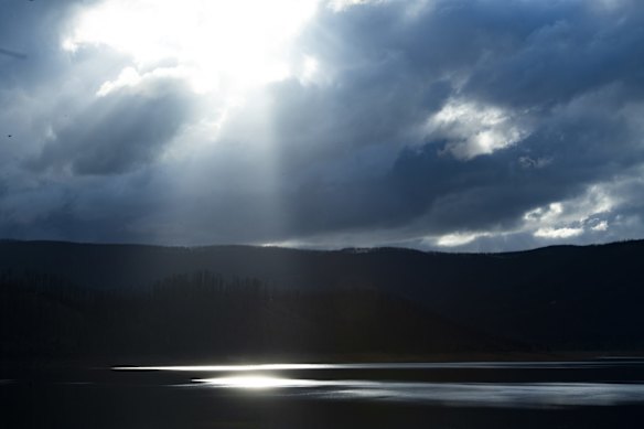 Sun hitting Bowering Dam on the Tumut River upstream of Tumut in the Snowy Mountains region. The area is returning to life after the Dunns Road fire impacted the area in January this year.