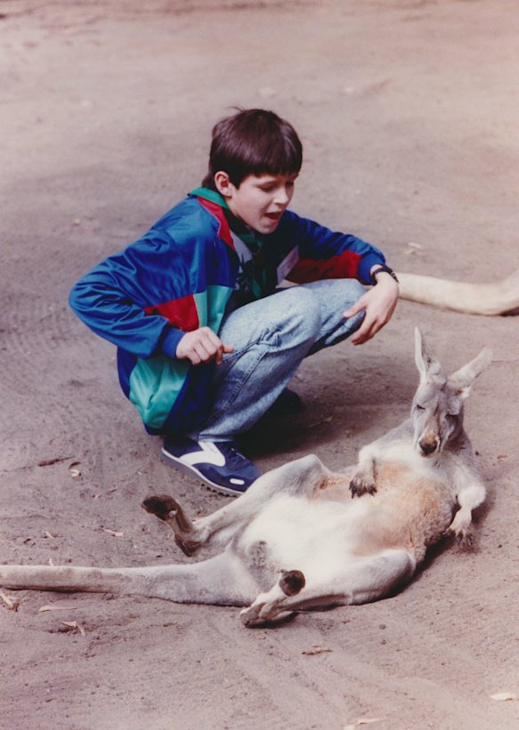 Sergei Gartok, a victim of the Soviet Union's Chernobyl nuclear explosion, found a sleepy friend at the Melbourne Zoo. He and 41 other children with radiation sickness joined their Scout hosts and the Victorian Premier, Mrs Kirner, to see the animals. The children were the guests of the Victims of Chernobyl National Relief Fund and stayed with Australian families for more than a month, April 4, 1991. Photo:  Bruce Postle

File (Melb): SOVIET UNION: ACCIDENTS & DISASTERS: NUCLEAR: CHERNOBYL: 1991 - .
Date filed: 05-04-1991
Neg no: 91-13622 [or 93-44385 c/n]
ID: mls