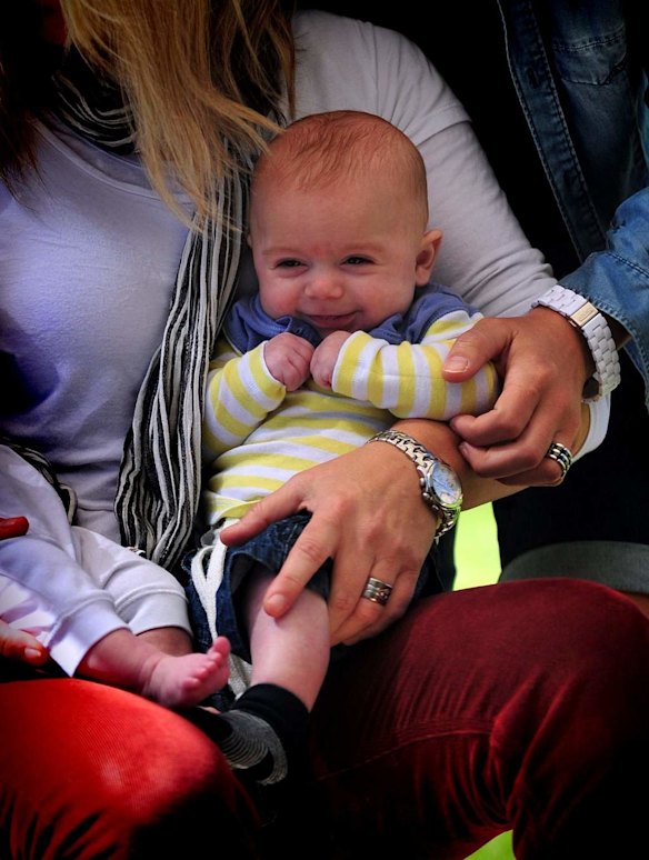 Canberra Capitals coach Carrie Graf, with partner Camille Chicheportische, and baby twins Bentley and Charli.