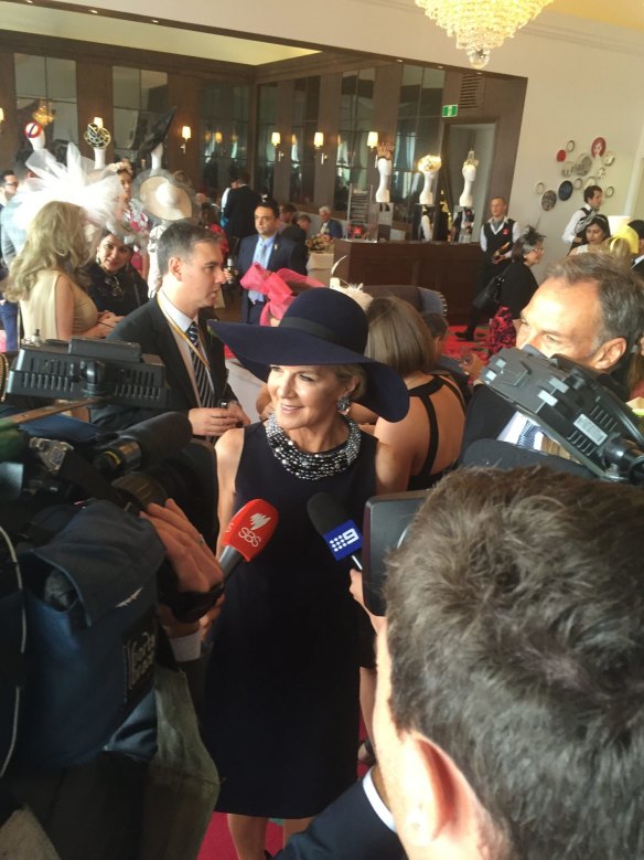 Foreign Minister Julie Bishop arrives at the Melbourne Cup with partner David Panton in tow.