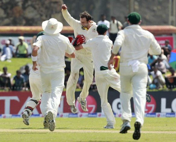 Nathan Lyon celebrates one of his five wickets on debut at Galle in 2011.