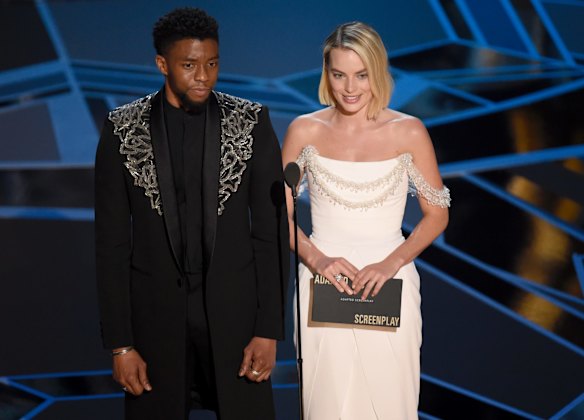 Chadwick Boseman, left, and Margot Robbie present the award for best adapted screenplay.