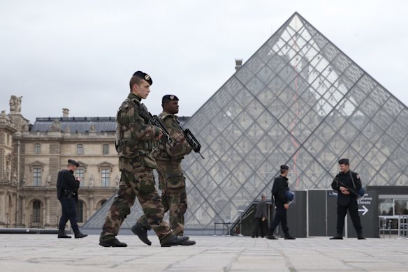 French military and police patrol the Louvre in Paris France which reopened on Monday 16 November.