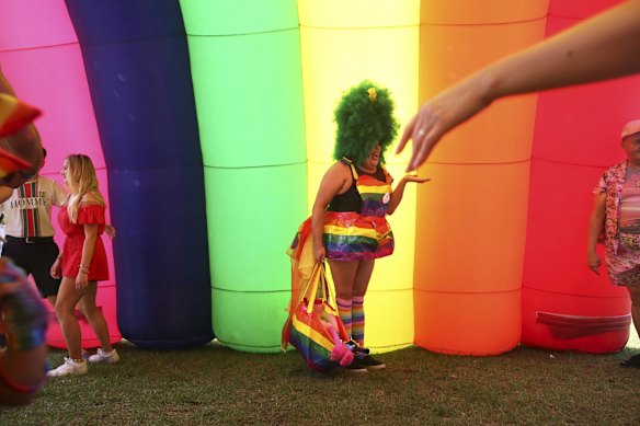 A colourful crowd enjoy the festivities and entertainment at the Gay & Lesbian Mardi Gras Fair Day at Victoria Park, Sydney.