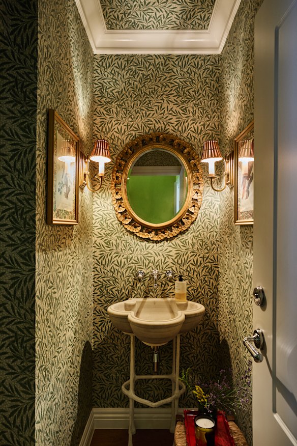 The powder room was dreadful, with chipped taps and grey laminate. I used ‘Emery’s Willow’ wallpaper by Morris & Co and found the basin at Fossil Vintage.”