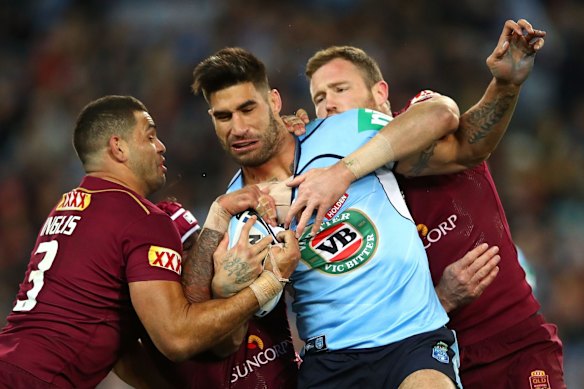James Tamou of the Blues is tackled