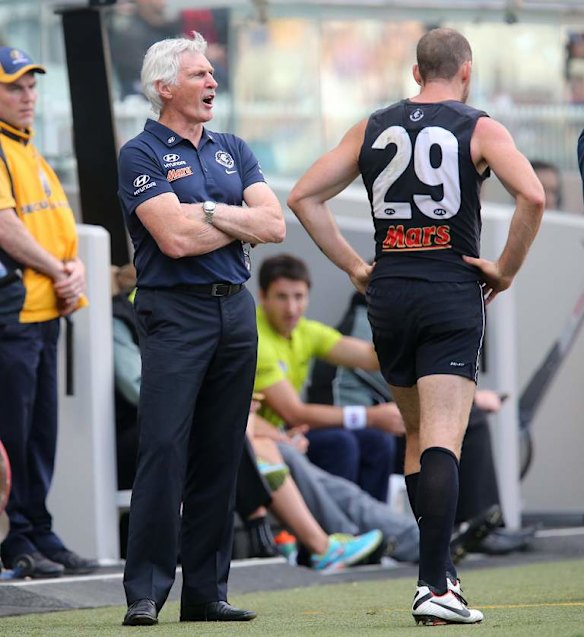 Mick Malthouse on his way to addressing  his players at 3/4 time.
