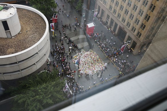 Thousands of bouquets of flowers in Martin Place, as seen from above.