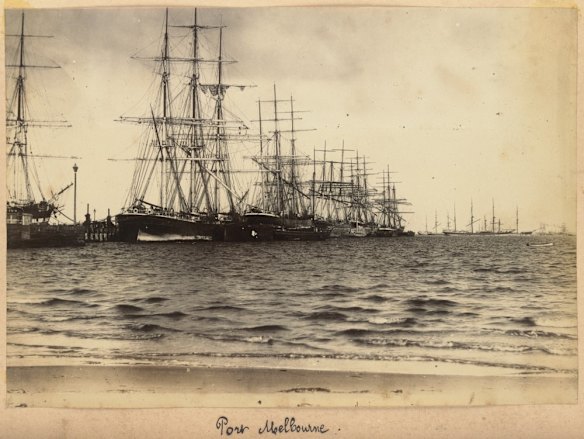 View looking over water to ships at a pier, with other ships on the bay in the background, ca. 1890-ca. 1892. Credit: Albert Dubucand compiler/State Library of Victoria