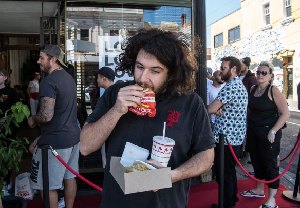 Jordan Zaz eats a burger. He says it's "fine".