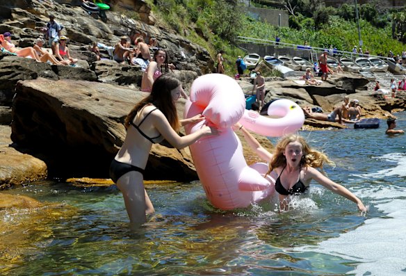 Swimmers celebrate New Years Day with their floaties at Gordons Bay in Sydney. 