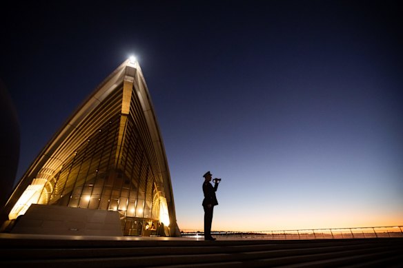 An Anzac Day service at dawn on the steps of the Sydney Opera House.