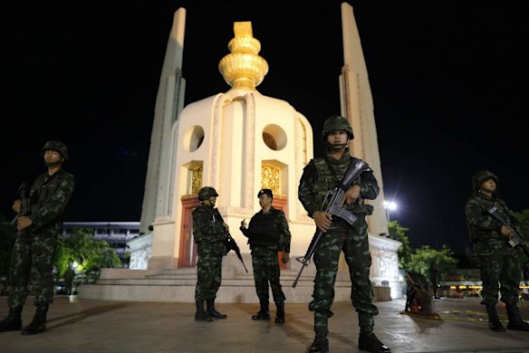 Soldiers take up position at the democracy monument.
