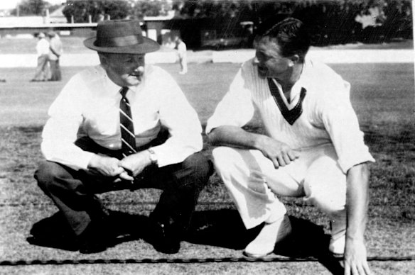 12 December 1960 Don Bradman & Richie Benaud Inspect test Wicket. Selector Sir Donald Bradman examines today's First Test Wicket with the Australian Captain, Richie Benaud. 