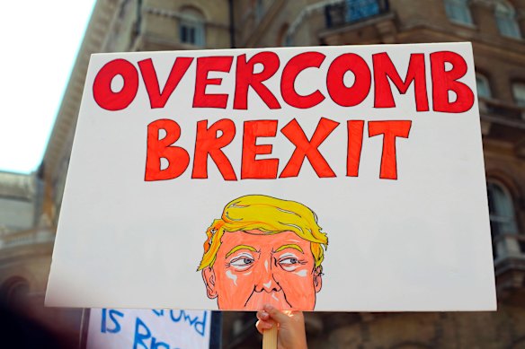 'Overcomb Brexit'. Protesters for the 'Stop Trump' Women's March gather in London, Friday, July 13, 2018. 