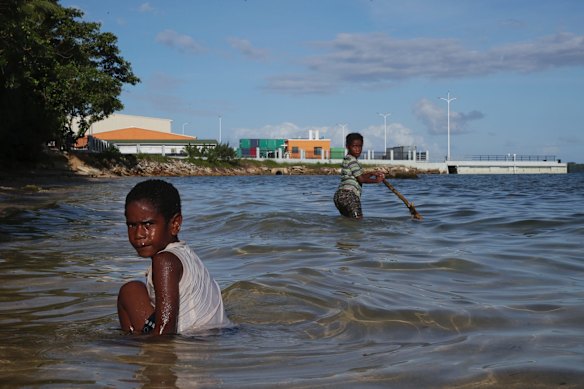 Ni-Vanuatu children playing in the waters next to the new wharf.
