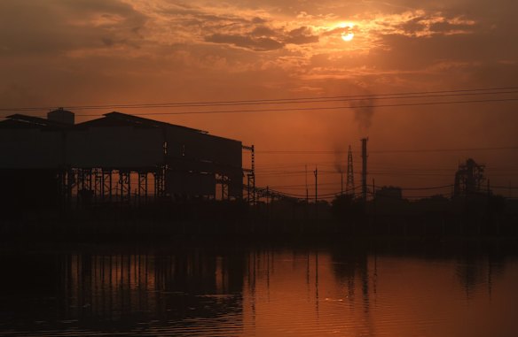 Power lines stretch across the landscape in the industrial outskirts of Raipur, the capital of central India's Chhattisgarh state. Adani Power Ltd is the largest private power producer in India.