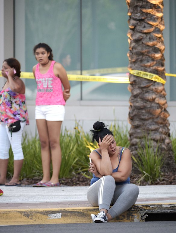 Relatives wait outside the emergency entrance of the Orlando Regional Medical Center hospital.