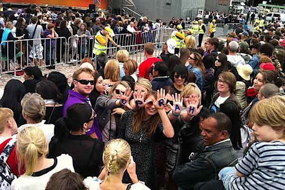 Oprah fans await the star's arrival at Federation Square.