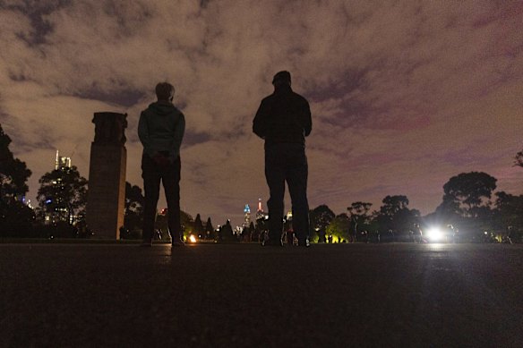 People pay their respects during the Anzac Day Dawn Service at the Shrine of Remembrance in Melbourne, Saturday, April 25, 2019. 