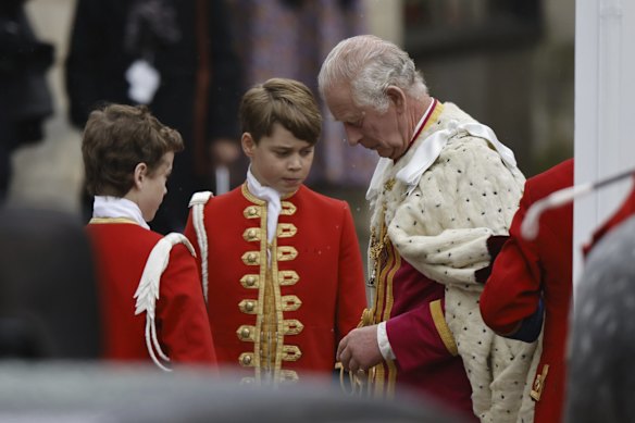 King Charles III speaks with Prince George outside Westminster Abbey ahead of the coronation.