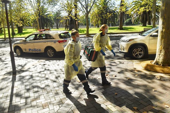 Ambulance officers arrive at the Intercontinental Hotel in Sydney.