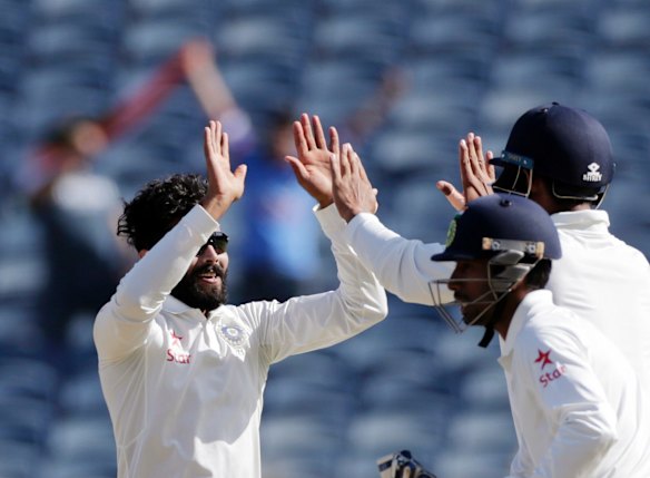India's Ravindra Jadeja celebrates Mitch Marsh's wicket.