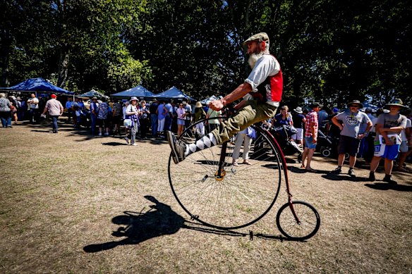The Lost Trades Fair at Kyneton Racecourse. Ross West on his penny farthing.