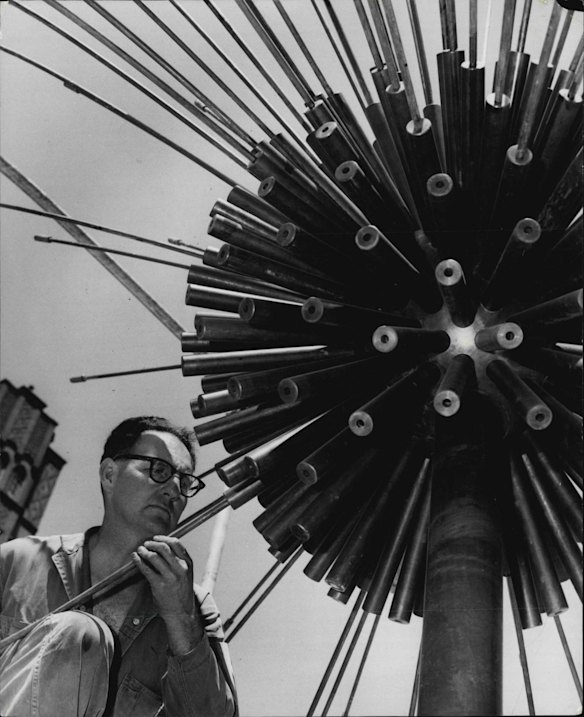 The El Alamain fountain in Fitroy Gardens, Kings Cross is nearing completion. But the fountain which due to be unveiled next week is already bringing comment from the citizens of the "cross". Such comments as the Kings Cross hedgehog and the Kings Cross Sputnik were overhead. Mr. Eric Williams of East Roseville screws in some of the brass sprays. 23rd October 1961.