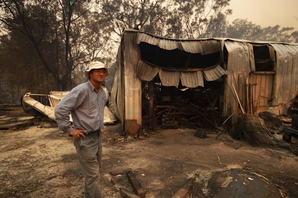 Rob Meggs inspects his shed after the Wrights Creek fire had swept through Kyola Rd on the outskirts of Kulnura, west of the Central Coast.