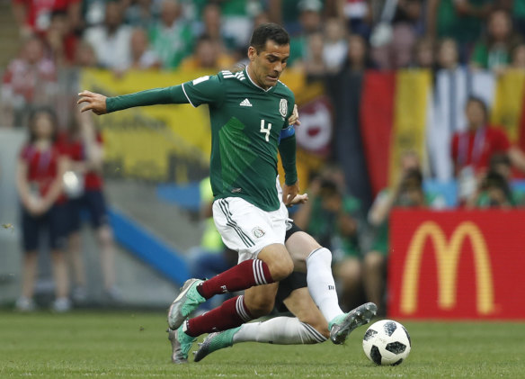 Mexico's Rafael Marquez clashes with Germany's Marco Reus during the World Cup match between Germany and Mexico in Moscow.