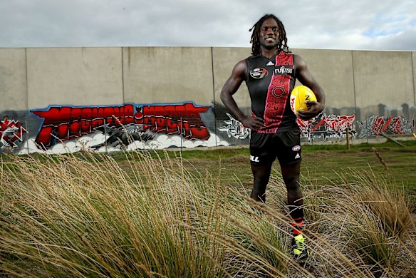 McDonald-Tipungwuti poses for a portrait at Essendon's training grounds.