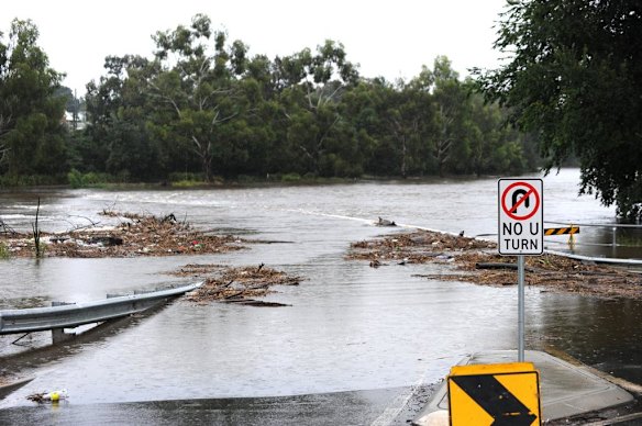 A low bridge is closed due to flooding in Queanbeyan.