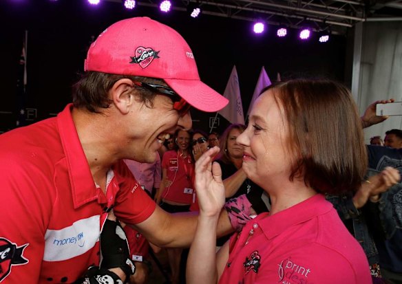 Samuel Johnson celebrates  crossing the finish line after his year-long Love Your Sister unicycle trek. Pictured with his sister Connie.