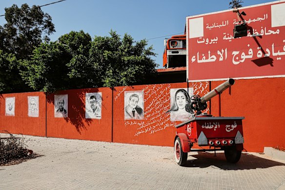 Drawings of the fire fighter's who were victims of last year's blast, are seen on the wall of the fire station.
