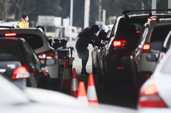 COVID testing at Merrylands Park Drive-through Clinic, as NSW Premier Gladys Berejiklian announces tighter restrictions for Greater Sydney in the face of a COVID Delta outbreak across the city.