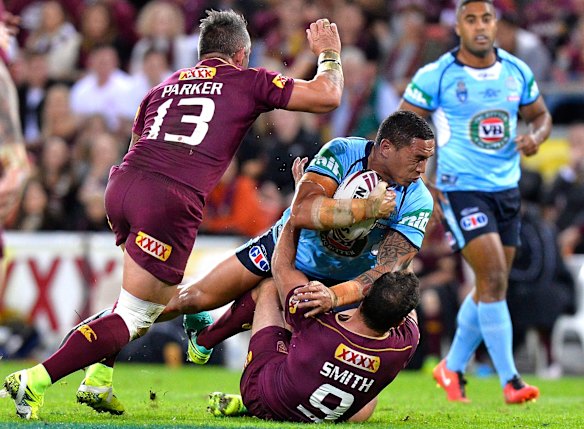 Tyson Frizell of the Blues is tackled