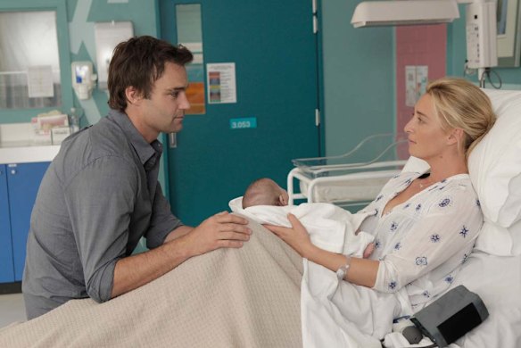 Patrick meets his newborn daughter.