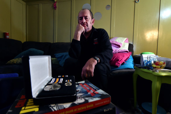 Ian Harris, alone with his medals.