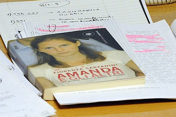 A book about Amanda Knox lies on the table of her defence lawyer during her trial.