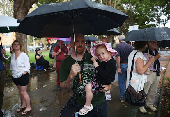 SYDNEY, AUSTRALIA - MARCH 16:  Protesters brave the wet and miserable conditions to demonstrate against the Abbott led Coalition Government on March 16, 2014 in Sydney, Australia. March In March is a nationwide grassroots protest organized to deliver a statement of no confidence in the current Australian Government.  (Photo by Don Arnold/Getty Images)