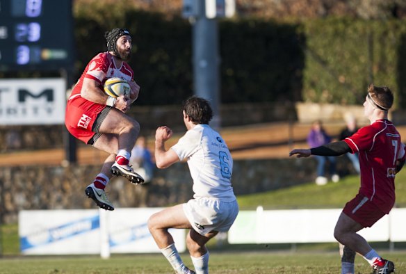 Vikings' Isaac Thompson goes up for the ball.