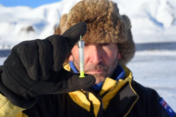 Marcus Fillinger at the north pole with the standard dart he says can deliver fertility control to kangaroos , ending the need for them to be shot.
